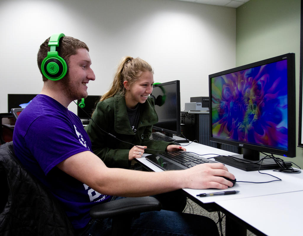 Journalism student sorting through printed newspapers