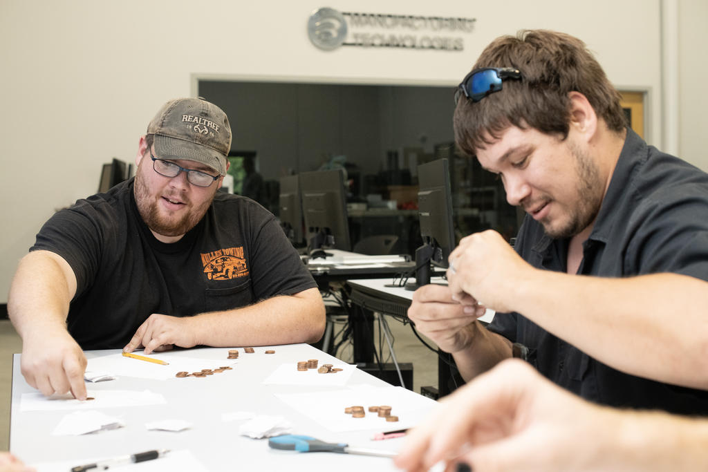 Engineering technology students working on class project