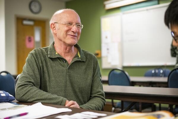 Professor smiling at student